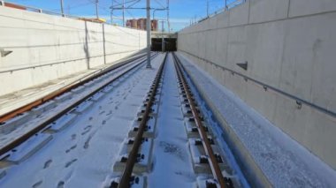 LRT rail way along Eglinton Avenue, connecting Mount Dennis in the west to Kennedy Station in the east. Surface level tracks. Improved transit service.