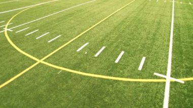 Sport games field grass view. Football field with green grass and white paint lines and marks. Sports soccer and football with nice green environment. Recreational activity ground.