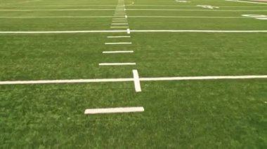 Soccer field view. Empty football playground. Sport stadium green grass and white paint lines and marks for games and activity. Healthy lifestyle.