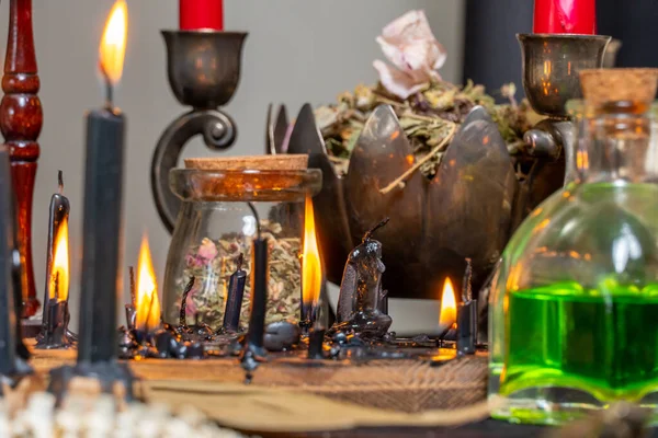 stock image Witchcraft composition selective focus with candles lights, magic items tools and symbols.  Occult and esoteric concept. Mystic Halloween. Magic chemistry and witch craft.