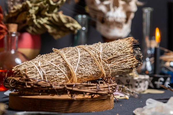 stock image Sage witchcraft aromatherapy and smudging, selective focus. Spiritual and cleansing supernatural science and occult knowledge. Smoking sage surrounded by magic tools. Performance of magic ritual.