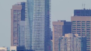 City of Toronto suffers through an unprecedented heat wave and heat haze caused by climate change. Hot summer time. Heatwave in North America. High temperatures and atmosphere distortion.