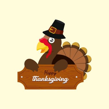 Bayram kutlamaları için ahşap Şükran Günü tabelasının arkasında hacı şapkası takan kahverengi hindi.