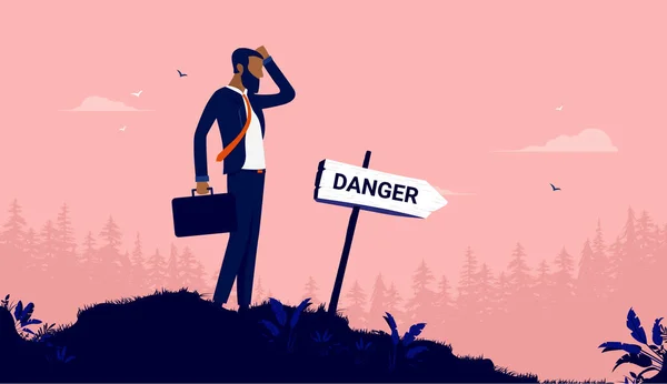 Biznes Niebezpieczeństwo Biznesmen Drapie Się Głowie Patrząc Znak Wskazujący Niebezpieczeństwo — Wektor stockowy