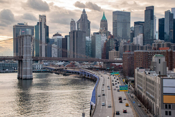 Panoramic view of Lower Manhattan with FDR drive in the foreground