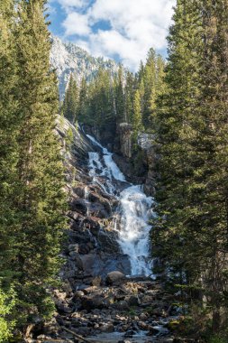 Hidden Falls, a waterfall in the Cascade Canyon of Grand Teton N clipart