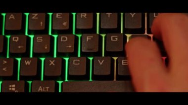 Hands typing on a computer pc keyboard  close up.