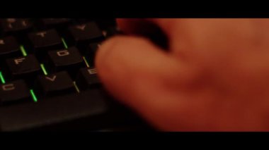 Hands typing on a computer pc keyboard  close up.