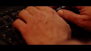 Close up video recording of laptop, notebook,mobile computer keyboard typing one or two hands or just one finger.