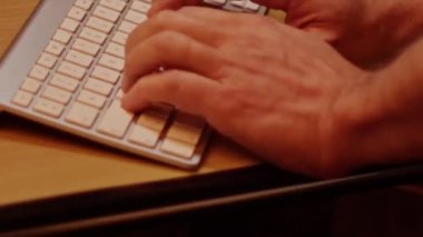 Close up video recording of laptop, notebook,mobile computer or desktop keyboard typing one or two hands or just one finger.