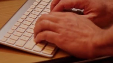 Close up video recording of laptop, notebook,mobile computer or desktop keyboard typing one or two hands or just one finger.