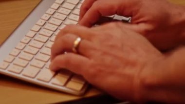 Close up video recording of laptop, notebook,mobile computer or desktop keyboard typing one or two hands or just one finger.