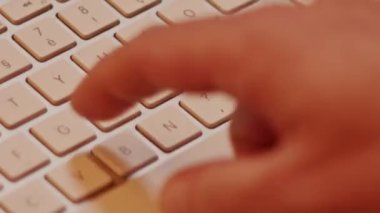 Close up video recording of laptop, notebook,mobile computer or desktop keyboard typing one or two hands or just one finger.
