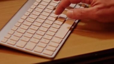 Close up video recording of laptop, notebook,mobile computer or desktop keyboard typing one or two hands or just one finger.