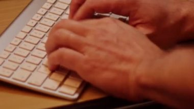 Close up video recording of laptop, notebook,mobile computer or desktop keyboard typing one or two hands or just one finger.