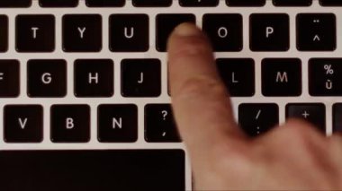 Close up video recording of laptop, notebook,mobile computer or desktop keyboard typing one or two hands or just one finger.
