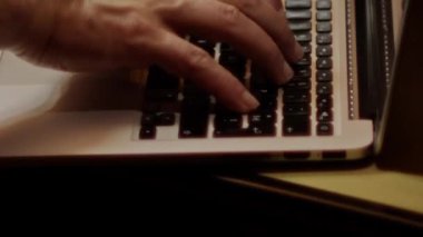 Close up video recording of laptop, notebook,mobile computer or desktop keyboard typing one or two hands or just one finger.