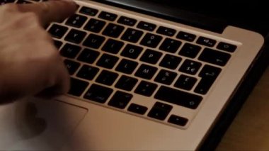 Close up video recording of laptop, notebook,mobile computer or desktop keyboard typing one or two hands or just one finger.