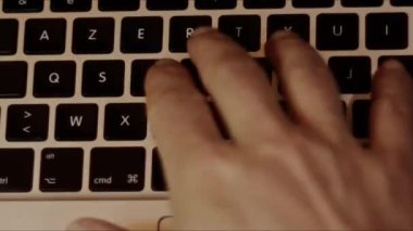 Close up video recording of laptop, notebook,mobile computer or desktop keyboard typing one or two hands or just one finger.