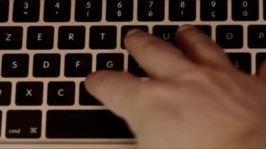 Close up video recording of laptop, notebook,mobile computer or desktop keyboard typing one or two hands or just one finger.
