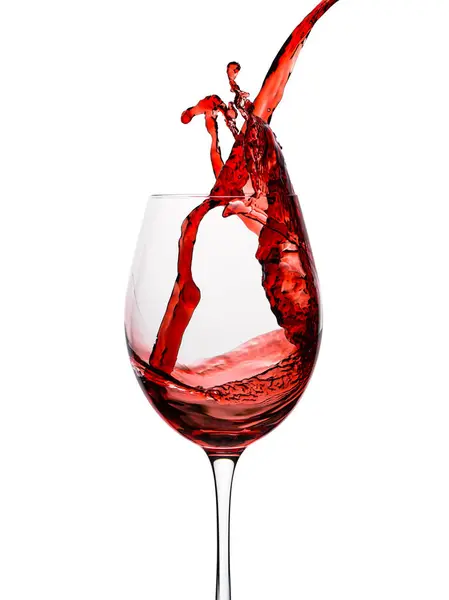 Wine. Glass of red, pink wine. Grape wine splash in wineglass. Alcohol drink party. Photo good for restaurant, bar. Merlot or Cabernet Sauvignon. Pouring into a glass. Isolated background