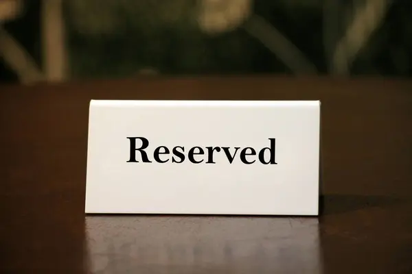 Reservation Card Wooden Table Closeup Stock Photo