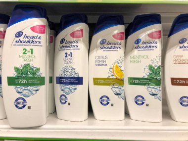 22.01.2023 Ukraine, Kharkiv, a shelf in a supermarket with hair shampoos: Head Shoulders shampoo in hair care products line in supermarket.