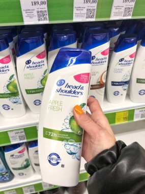 22.01.2023 Ukraine, Kharkiv, a shelf in a supermarket with hair shampoos: Head Shoulders shampoo in hair care products line in supermarket.