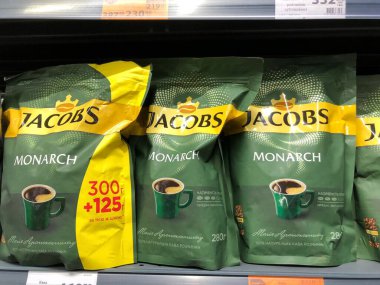 14.02.2023, Ukraine, Kharkov, a shelf in a supermarket with packs of Jacobs in grains. Aromatic, delicious coffee. 