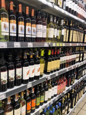 07.02.2023, Ukraine, Kharkiv, a large selection of wines of different varieties on the supermarket shelf