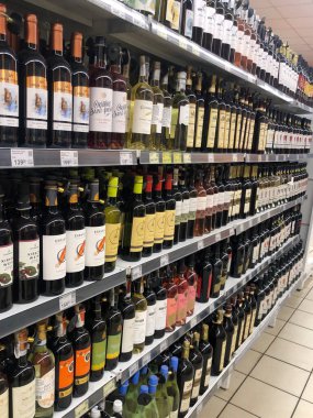 07.02.2023, Ukraine, Kharkiv, a large selection of wines of different varieties on the supermarket shelf