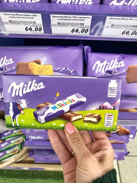 stock image 28.04.2023, Ukraine, Kharkiv, Milka chocolate on store shelves. Many wrappings of purple Milka chocolate. Milka is a chocolate confection manufactured by company Mondelez International. 