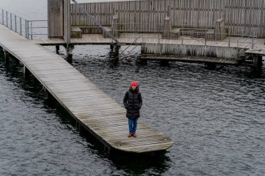 Travel. A woman walks around the city of Copenhagen. Denmark.