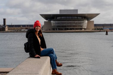 Travel. A woman walks around the city of Copenhagen. Denmark.