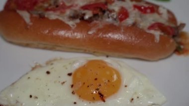 Cooking. Sandwich with sausage and tomato. Hot Dog.