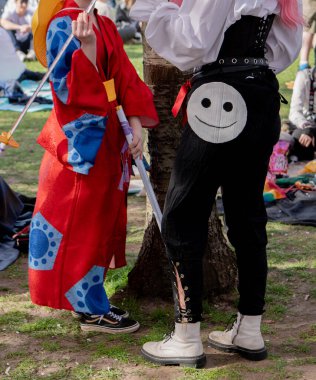 People in costumes at a street festival. clipart