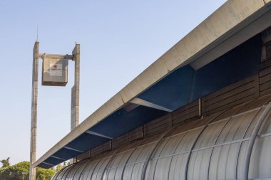 Architectural detail of the eul swimming pool complex with clear blue sky at lisbon university stadium clipart