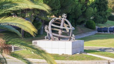 Metal armillary sphere in the gardens of the army geospatial information center - cigeoe - in lisbon, portugal clipart