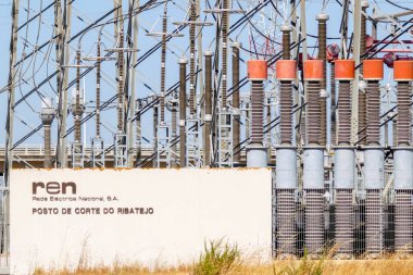 Industrial power substation showcasing high voltage electrical equipment and grid infrastructure