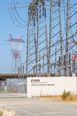 Electrical substation with pylons and power lines transferring high voltage electricity to the grid
