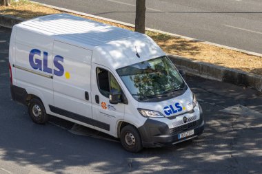Gls van delivering packages, highlighting global shipping and distribution