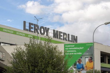 Large leroy merlin signage atop a building with a promotional banner advertising remodeling services, showcasing the brand's presence in the diy and construction market