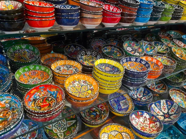 Multicolored painted ceramic oriental plates in the market at in Turkey. Oriental interior design. Turkish souvenirs