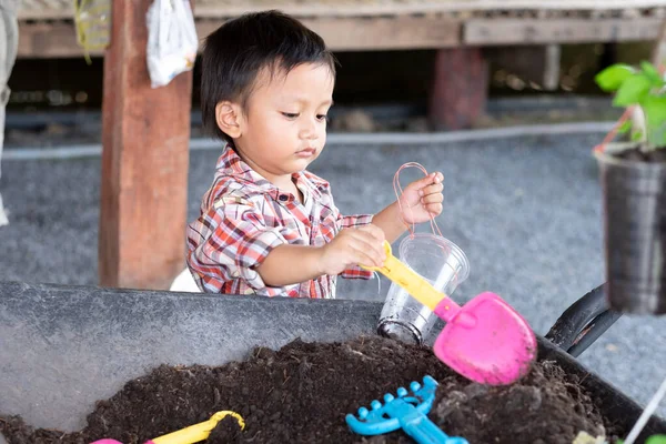 stock image A toddler boy digging soil for planting