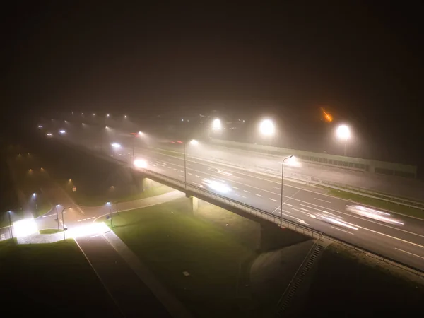 stock image Asphalt road highway in an autumn fog forest aerial top view