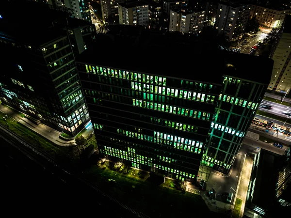 stock image Aerial view of intersection in Hong Kong Downtown. Financial district and business centers in smart city, technology concept. Top view of buildings at night.