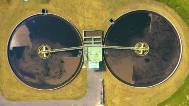 Aerial view of modern water cleaning facility at urban wastewater treatment plant. Purification process of removing undesirable chemicals, suspended solids and gases from contaminated liquid