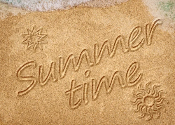 Summer time sign on the sand beach
