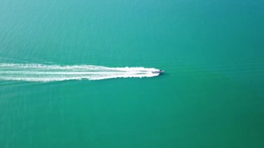 luxury boat aerial view, luxurious yacht moving fast in blue sea