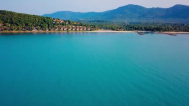4k Drone Footage of the Beach at Mae Nam on Koh Samui in Thailand, Including Beachfront Resorts with Beautiful Clouds in the Sky and Crystal Teal Water